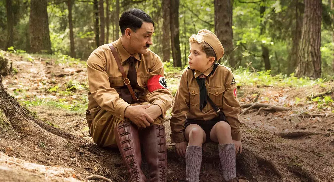 MENTOR? Imaginary friend, "Adolf" (writer-director Tailka Waititi), counsels Jojo (Roman Griffin Davis), a Nazi-in-training who's worried that his mother is hiding a Jew, in the satire Jojo Rabbit. - PHOTO COURTESY OF PIKI FILMS