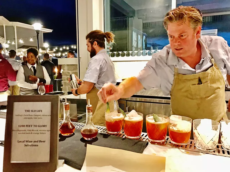 SIPPING THE SLO LIFE Gosling's dark rum, Campari, demerara syrup, pineapple, and lime juice are combined to create a delicious beachside cocktail called "The SLO Life." - PHOTO BY BETH GIUFFRE