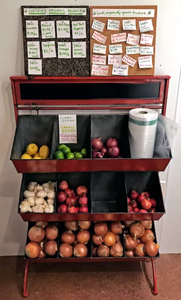 TAKE YOUR PICK The local harvests in Caliwala's bins make a pretty sight. It's helpful to see which are California Certified Organic and which are local, organically grown. - PHOTOS BY BETH GIUFFRE