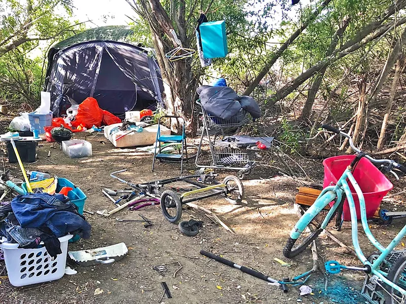 BEFORE Before the Blue Bag pilot launched in September, nearly every corner of the Higuera bridge homeless camp in SLO was overflowing with trash. - PHOTO COURTESY OF TIM WAAG