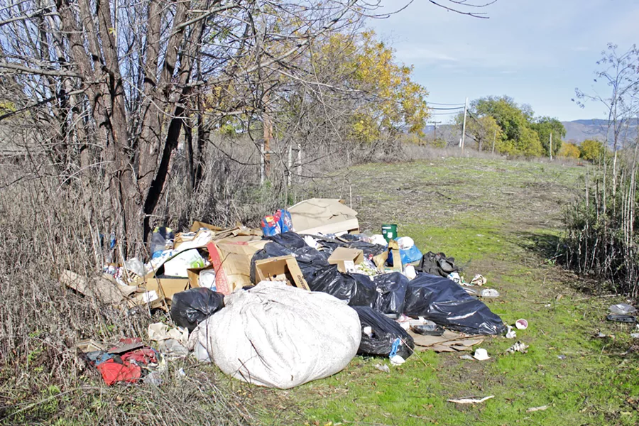 NOW About two months after the Blue Bag pilot's end, trash is building up again. - PHOTO BY KASEY BUBNASH