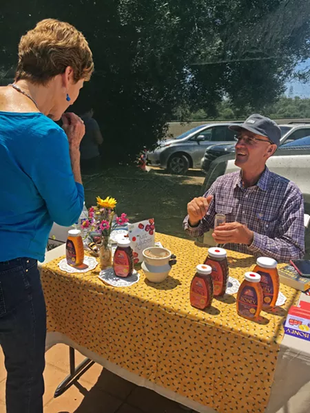 NEIGHBORS IN FOOD Knowing your local farmer, rancher, butcher, chocolatier, baker, beekeeper, and winemaker has been a trend in 2019, particularly in SLO County. Rock Front Ranch off Highway 166 gives out tastes of its honey at the Talley Farm Stand opening over the summer. - FILE PHOTO BY BETH GIUFFRE