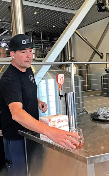 YEAR OF HYBRIDS AND SOURS Firestone Walker Brewing Company Head Brewer Dustin Kral pours Rosalie, a rosé/beer hybrid that led to one of the biggest drink trends in the nation. - FILE PHOTO BY BETH GIUFFRE