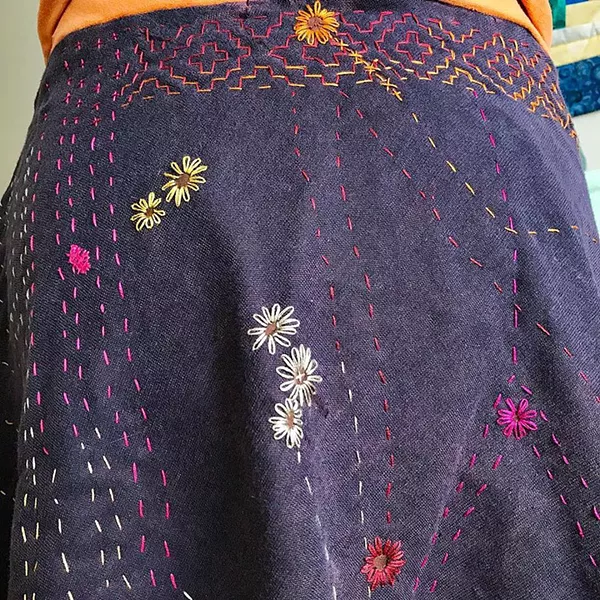 MENDED WITH FLOWERS Seamstress Rachael Hansen covered each of this skirt's many holes with hand-stitched flowers. - PHOTO COURTESY OF RACHEL HANSEN