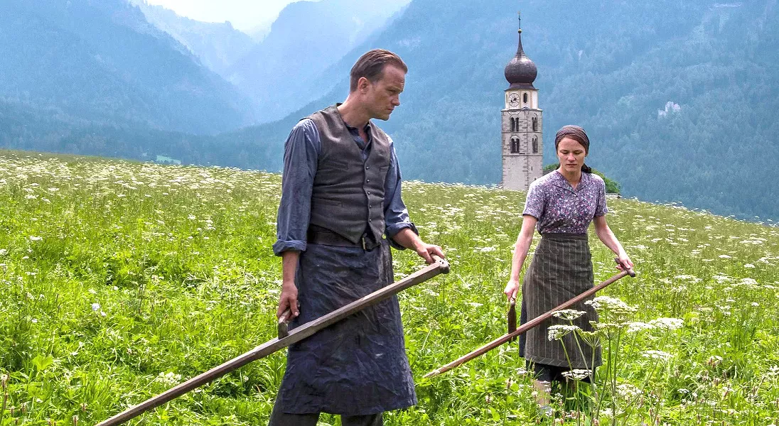 LAST CHANCE! August Diehl (left) stars as Austrian farmer Franz Jägerstätter, a conscientious objector who faces execution for refusing to fight for the Nazis in World War II, in auteur Terrance Malick's A Hidden Life, which leaves the Palm Theatre on Jan. 16. - PHOTO COURTESY OF STUDIO BABELSBERG