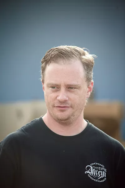 GRATEFUL Adam Harding, 35, is thankful to have a job at the SLO County Food Bank so he can provide for his family of four. - PHOTO BY JAYSON MELLOM