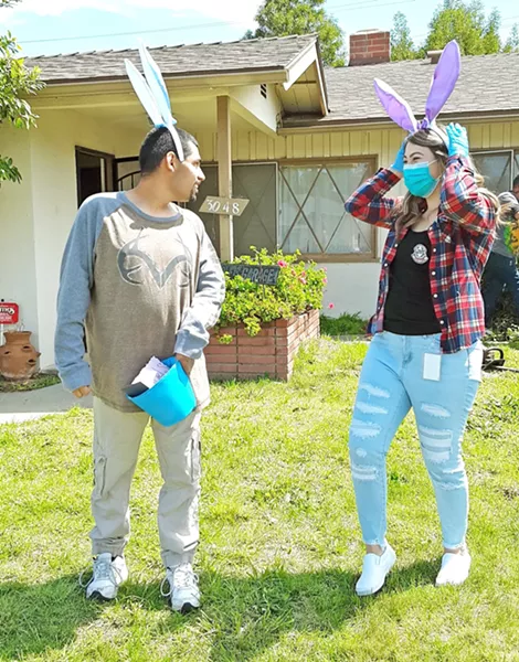 SOCIALLY DISTANT FUN A PathPoint employee surprises a client at his home with an Easter gift basket. PathPoint is staying connected with many clients virtually and from a safe distance. - PHOTO COURTESY OF JEANNIE BARBIERI-LOW