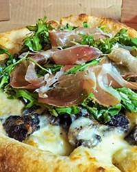 PIZZA TO-GO Local favorite, the Forager, comes with roasted mushrooms and a creamy white sauce.