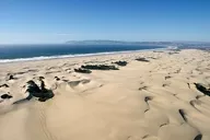 UP IN THE AIR: Off-road vehicles at Oceano are polluting the air around Nipomo Mesa with sand and dust particles. But what can be done? - PHOTO BY STEVE E. MILLER
