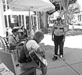 READING, AND SINGING, IN PUBLIC : James Darden is apprehended by security during his Reading in Public performance on Aug. 1. - PHOTO COURTESY OF NOTHING HAPPENED HERE