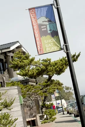 SIGN OF THE TIMES : Small-business owners in Morro Bay are up in arms after the city enacted a controversial sign ordinance and yanked money from the harbor fund to pay for an Embarcadero beautification project. - PHOTO BY STEVE E. MILLER