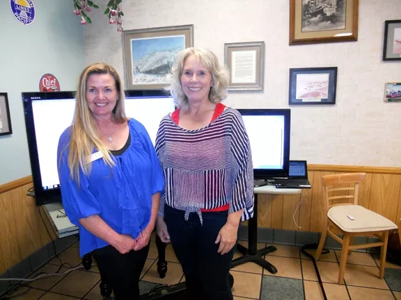 CHEERS : Karen Bright, who made a successful run for Grover Beach City Council, and Debbie Peterson, the future mayor of Grover Beach, paused during a particularly happening shindig at Station Grill in Grover Beach. - PHOTO BY TAYLER DUPREL