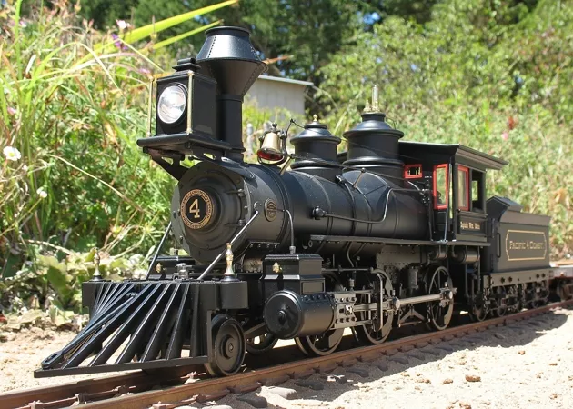 RIGHT ON TIME : A No. 4 Baldwin Locomotive Works steam engine rides its tiny tracks in down-to-the-rivet detailed glory. - PHOTO BY DENNIS PEARSON