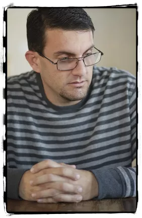 PISSED : Chris Austin, whose wife and brother-in-law were arrested after an early morning search of their home, said he followed state law in operating his collective and that child endangerment charges levied against he and his wife are “malicious.” - PHOTO BY STEVE E. MILLER
