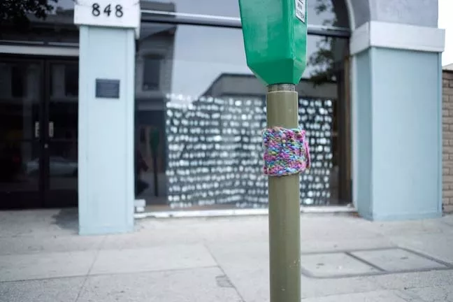 KNIT TAG : Even a humdrum parking meter looks a little cozier with knitted apparel. - PHOTO BY STEVE E. MILLER
