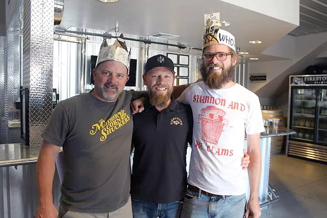 WINEMAKERS GET FROTHY: From left to right, winemaker Sherman Thacher of Thacher Winery, Firestone Walker Brewing Co. Brewmaster Matt Brynildson, and Daniel Callan of Thacher Winery. Thacher and Callan created the winning blend that became the basis for Firestone’s XIX Anniversary Ale (hence, the crowns). - PHOTO COURTESY OF FIRESTONE WALKER BREWING CO.