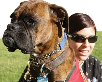 AT THE HIP : Sachi Bobge, 21, takes her dog Koda everywhere for emotional support. - PHOTO BY STEVE E. MILLER