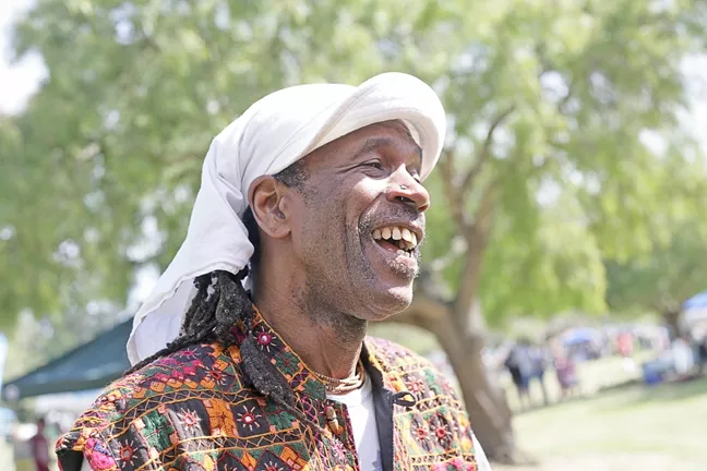 EARTH DAY SMILES : Everyone had a great time, including local musician Al “Shival” Redwine, at Earth Day. - PHOTO BY GLEN STARKEY