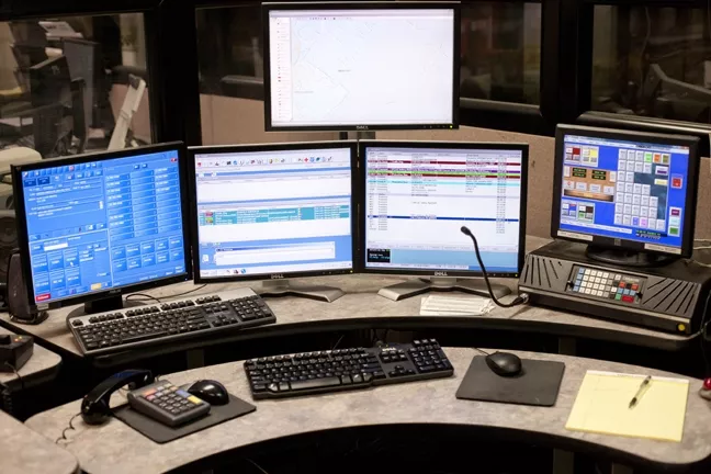 COMMAND CENTRAL: On any given night, there are two to four dispatchers with the San Luis Obispo County Sheriff’s Department stationed at consoles just like this one. - PHOTO BY STEVE E. MILLER