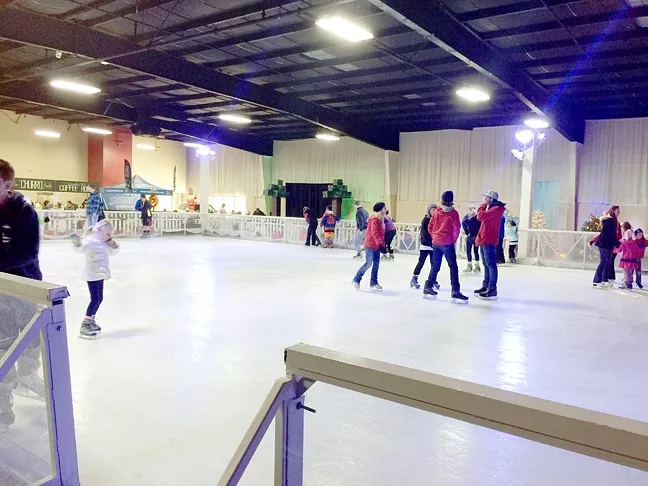 SKATING IN A WINTER WONDERLAND: The young and old alike ventured out the day after Christmas to catch some fleeting holiday magic at the Winter WonderSLO ice skating rink. - PHOTO BY RYAH COOLEY