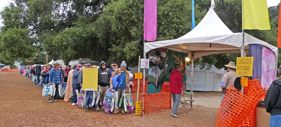 LINE UP! : Every morning, concertgoers line up to place their chairs at the main stage, reserving their spot for the day’s music line-up. - PHOTO BY GARY ROBERTSHAW