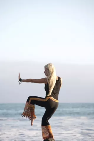 WORKOUT WISE : Nia instructor Calico Hauser offers body and nature friendly workouts at the beach. - PHOTO BY JESSE ACOSTA