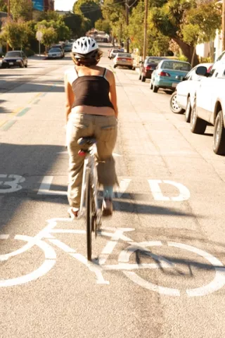ON THE STREET : Kylie Mendonca availed herself of a bike, car, scooter, bus, and old-fashioned thumb to discover the best way for students to get from here to there in San Luis Obispo County. - PHOTO BY STEVE E. MILLER
