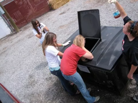 IN THE LINE OF DUTY : (l-r) Audrey Faber, Alyssa Tennant, Aubrey Wynn, and Caitlyn Arigo checked the quality of the vegetable oil at a storage bin in Gallup, N.M., to ensure that there's no shortening. - PHOTO COURTESY OF VEGGIE GIRLS