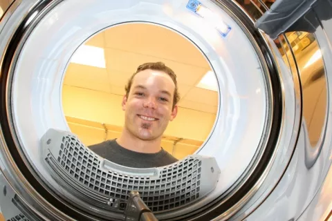 MISTER CLEAN : The future is bright and shiny for Nate Miller, owner of “Fresh Threads� full service launderia. - PHOTO BY CHRISTOPHER GARDNER