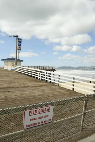 DON'T WALK ON WATER : Recent heavy swells prompted the closure of the Pismo Beach pier. - PHOTO BY STEVE E. MILLER