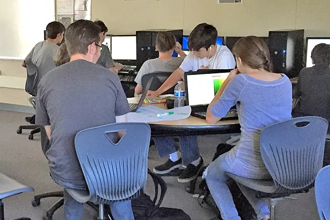 HACKING TO THE TOP : Students from SLO work within a nine-hour period to turn their ideas into a final product. - PHOTO BY ALEXANDER DAVIDSON