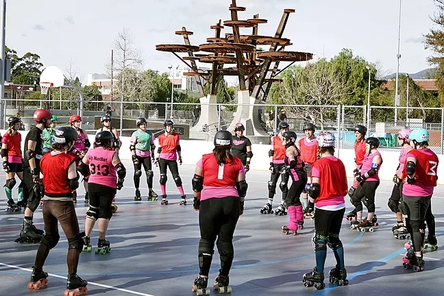 TOUGH TIMES: Pinball 5x5, president of Central Coast Roller Derby, works with new recruits at the Derby 101 Boot Camp. The group has had trouble finding appropriate spaces to practice and compete, and they worry that the loss of a roller rink at Del Mar Park in Morro Bay—which is under consideration for conversion to pickleball courts—will worsen that situation. - PHOTO COURTESY OF JO SEAQUIST