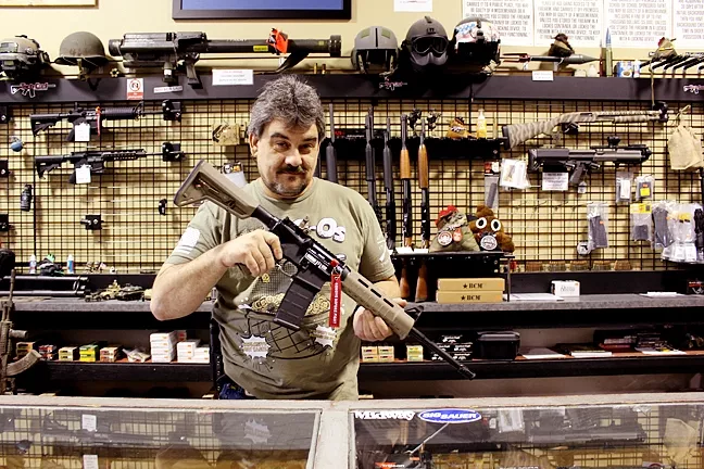 AR-15: This semi-automatic rifle—one of Tacti-Cool Guns’ best sellers—would become illegal under Assembly Bill 1135. - PHOTO BY BRENNA SWANSTON