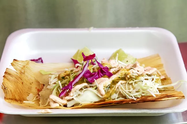 TASTE AND PRESENTATION: A chile relleno tamale garnished with toppings and Steven Sullivan’s signature “Consuela” sauce. - PHOTO BY DYLAN HONEA-BAUMANN