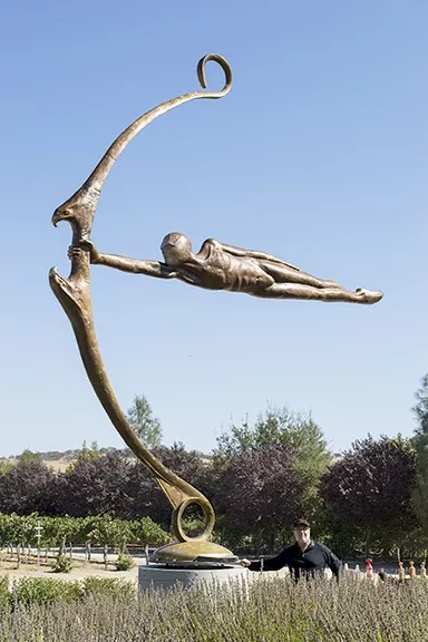 TURNING INWARD: Artist Dale Ever’s 24-foot tall sculpture, Mega Focus, is placed at Sculpterra Winery in Paso Robles and represents the transcendent version of ourselves. - PHOTO COURTESY OF DALE EVERS STUDIO