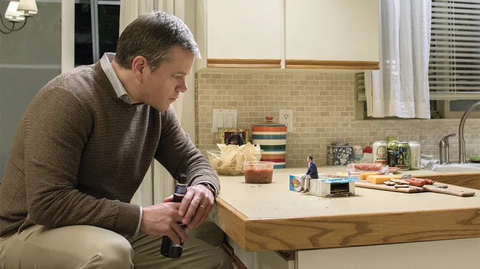 GET SMALL In Downsizing, Paul (Matt Damon, left) tries to get more out of life by being shrunk down to just five inches tall. - PHOTO COURTESY OF PARAMOUNT PICTURES