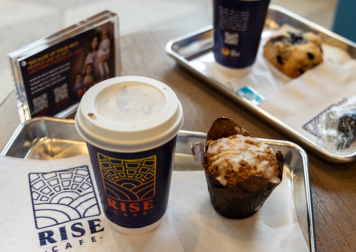 A coffee and blueberry muffin from Rise Cafe. - BERLIN GREEN