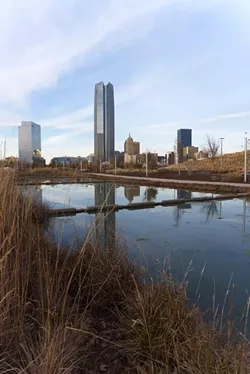 The golden hour before sunset makes a memorable image of the Devon Tower's silhouette as viewed from Scissortail Trail Park. - KENDRA MICHAL JOHNSON