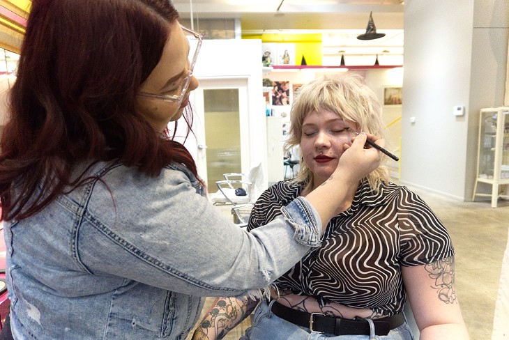 Brushed Salon and Makeup Studio owner Samantha McLoud demonstrates touching up eye makeup on hair stylist Tayler Shackelford - KENDRA MICHAL JOHNSON