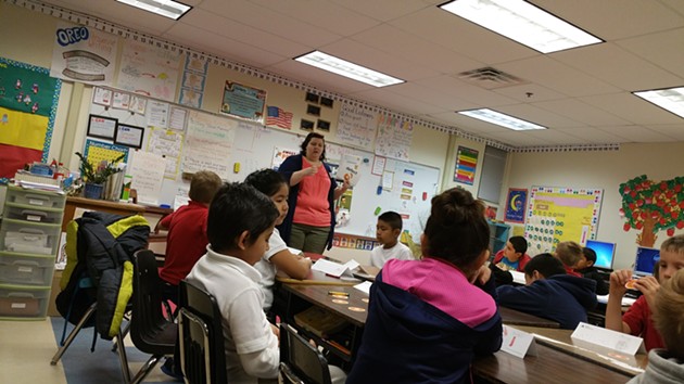 Andrea Douglas, a volunteer with Junior Achievement and the Oklahoma JumpStart Coalition, taught financial literacy to a class at Hawthorne Elementary. - BEN FELDER