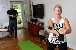 Rick Thomas trains Ben and Ashley Sellers at their home in Oklahoma City. (Garett Fisbeck)