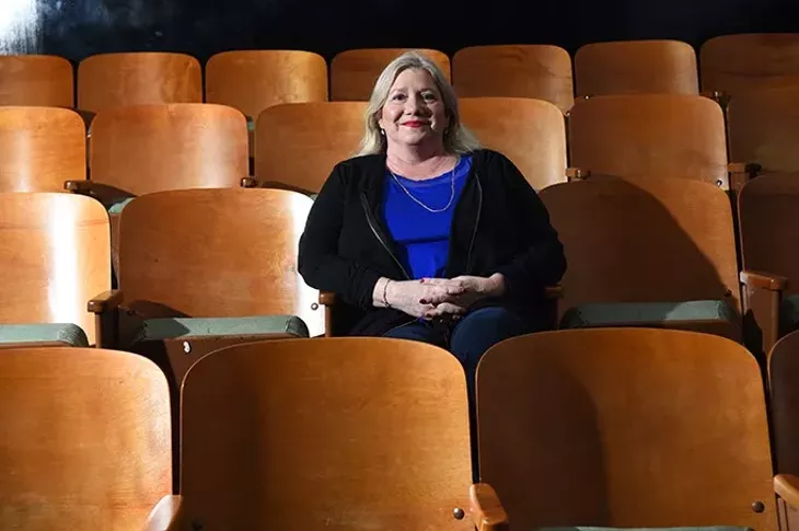 Recently divorced Tammy McKee might just attend a movie alone this Valentines Day, shown illustrating this idea at the Paraamount OKC theater, Film Row, Oklahoma City, 1-26-16. - MARK HANCOCK