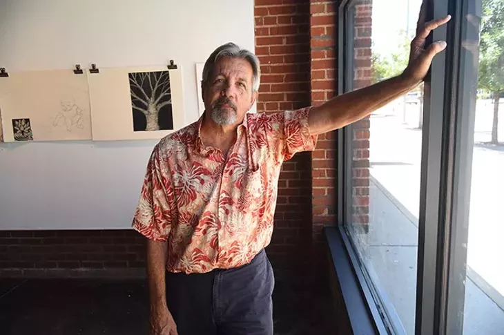 Artist George Oswalt photographed at IAO Gallery on Film Rom where he was found working on the "The Elaborate Colaborate" exhibit set-up. mh