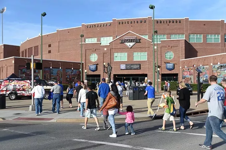 Fans arrive for the season opener at the Chickasaw Bricktown Ballpark with the OKC Dogers vs Round Rock Express, 4-9-15. mh