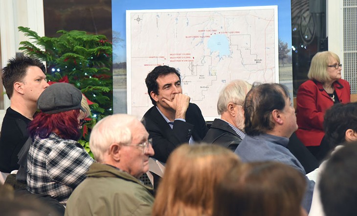 Ward 2 councilman Ed Shadid listens from the crowd during the public hearing on Fracking at Lake Hefner, held in a greenhouse at Will Rogers Park, 12-18-14.  mh