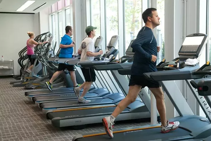 Patrons working out during the lunch hour recently at the Main Street YMCA. mh