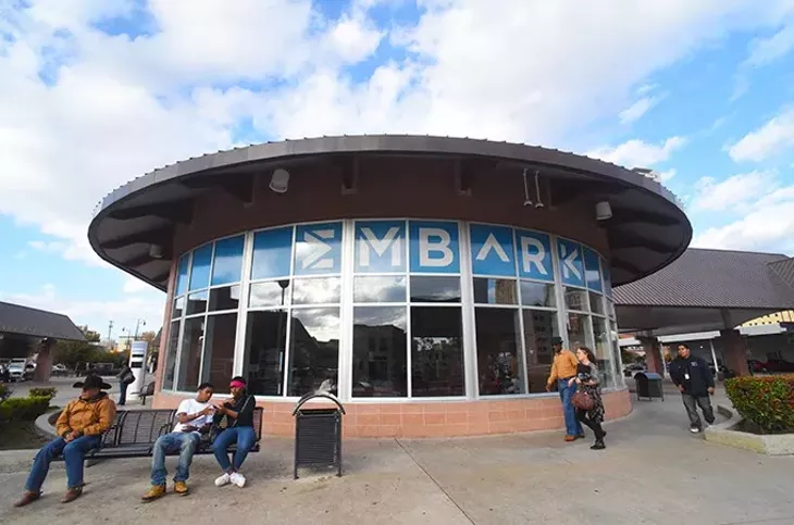 People waiting for their various buses, at the Embark downtown transite station, 11-20-15. - MARK HANCOCK