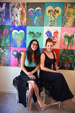 Left to right, Lindsey Michelle Webb and Kelly Brinkmeyer with breast-print paintings, 9-22-15. - MARK HANCOCK