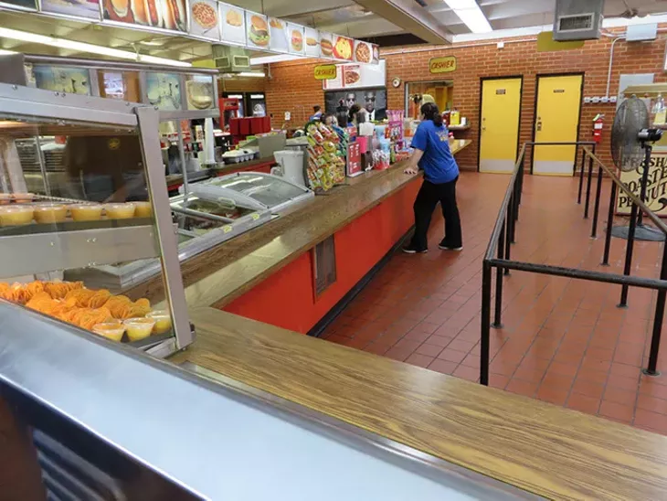 A guest orders from the brightly lit concession stand at Winchester Drive-In. (Brett Dickerson)