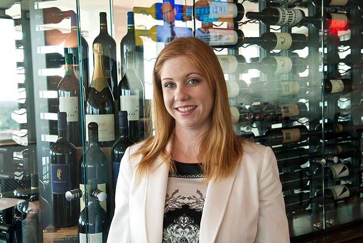 The George's female sommelier Mindie Magers with its extensive wine collection. (Mark Hancock)